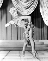 Virginia Mayo bending over photo print, classic vintage Hollywood image.