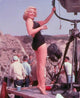 Cleo Moore photo print featuring camera lights, vintage Hollywood style.