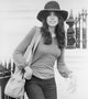 Carly Simon photo print featuring long sleeves and a hat.