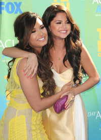 Demi Lovato and Selena Gomez at the Teen Choice Awards 2011 photo print.