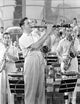 Candid photo print of Benny Goodman with his band, showcasing the vibrant energy of jazz music.