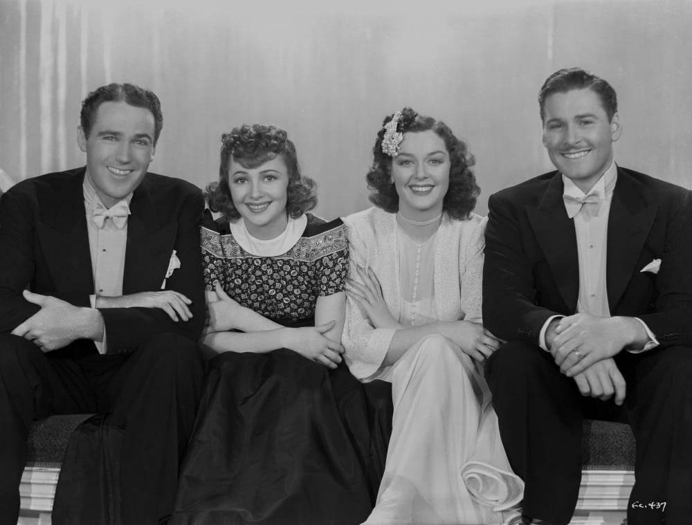 Errol Flynn classic photo print featuring a group seated.
