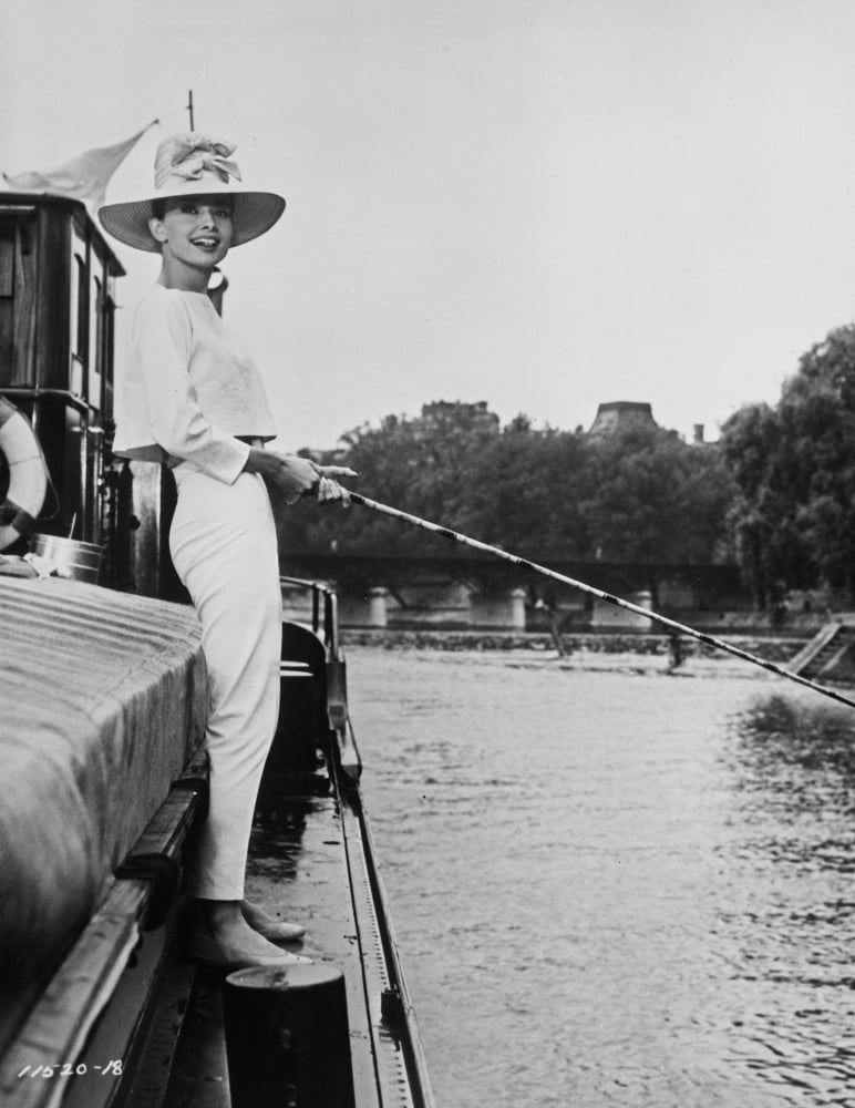 Audrey Hepburn Fishing Photo Print showcasing classic Hollywood elegance.