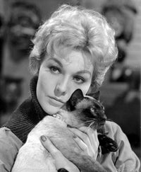 Kim Novak holding a cat portrait photo print.