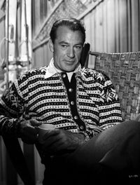 Gary Cooper seated in striped collared shirt photo print.