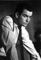 Charlie Sheen film still photo print in striped shirt and tie.