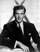 Roger Moore iconic photo print capturing his charisma and charm.