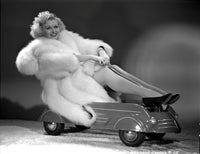 Barbara Pepper sitting in a furry coat photo print