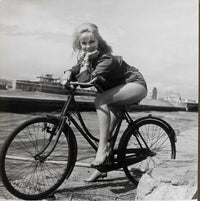 Elke Sommer Riding Bike Photo Print - 8x10, 16x20, 24x30