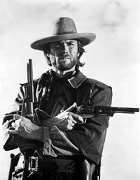 Clint Eastwood posed in cowboy attire with two pistols photo print
