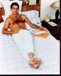Mark Harmon shirtless photo print lounging on bed in white pants.