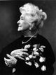 Helen Hayes photo print carrying roses, classic Hollywood portrait.