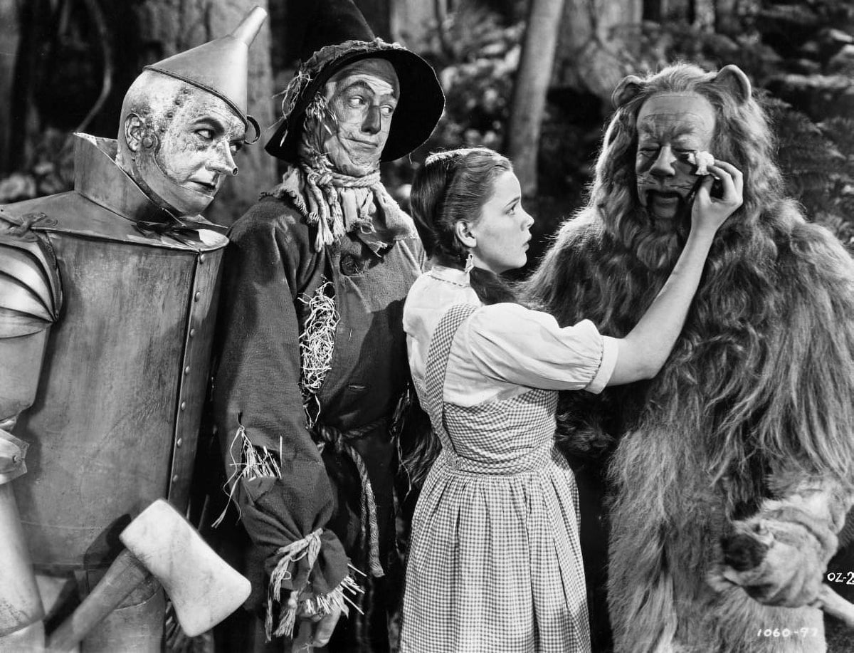 Wizard of Oz photo print of Dorothy comforting the Cowardly Lion.