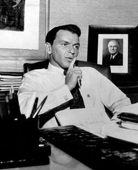 Frank Sinatra photo print at a desk, iconic music legend.