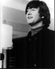 Black and white photo print of John Lennon in a turtleneck and jacket.