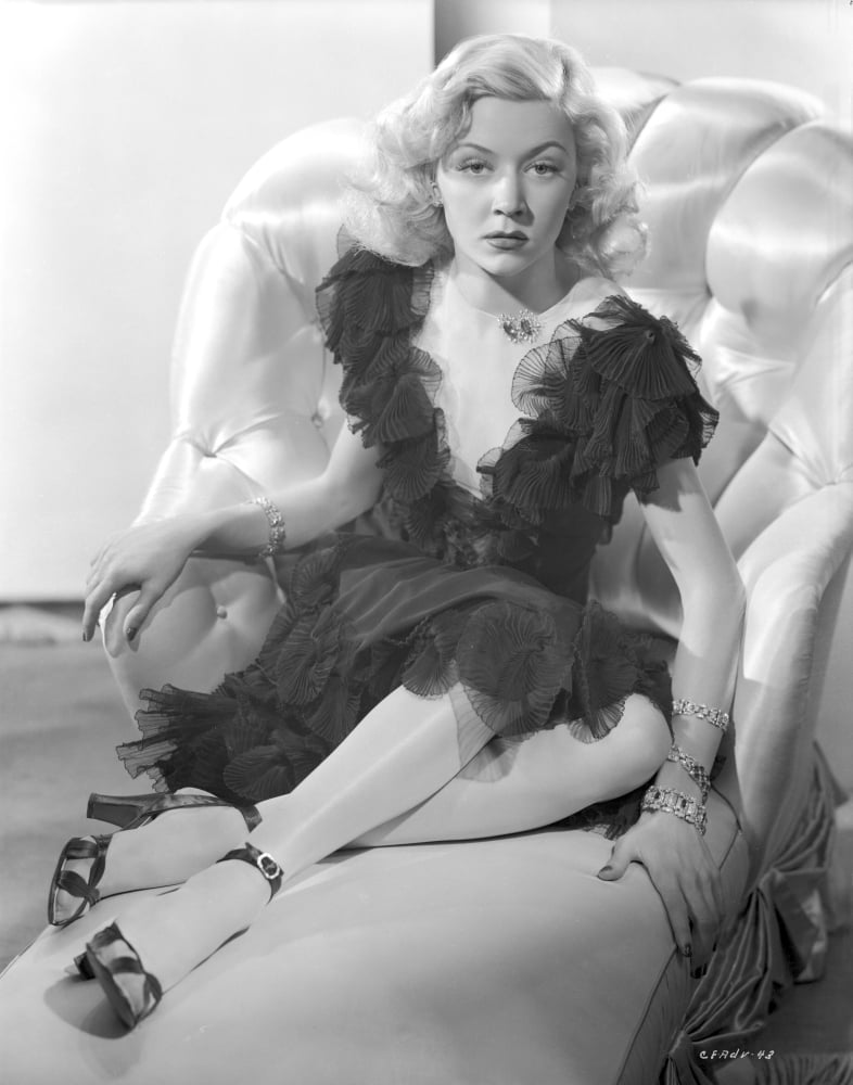 Gloria Grahame posed on couch in elegant black dress photo print