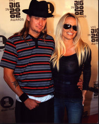 Kid Rock and Pamela Anderson photo print featuring Kid Rock in a striped shirt and Pamela Anderson in a black sheer top.