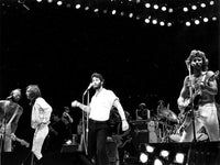 The Bee Gees on stage with John Travolta photo print.
