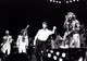 The Bee Gees performing live on stage with John Travolta photo print.