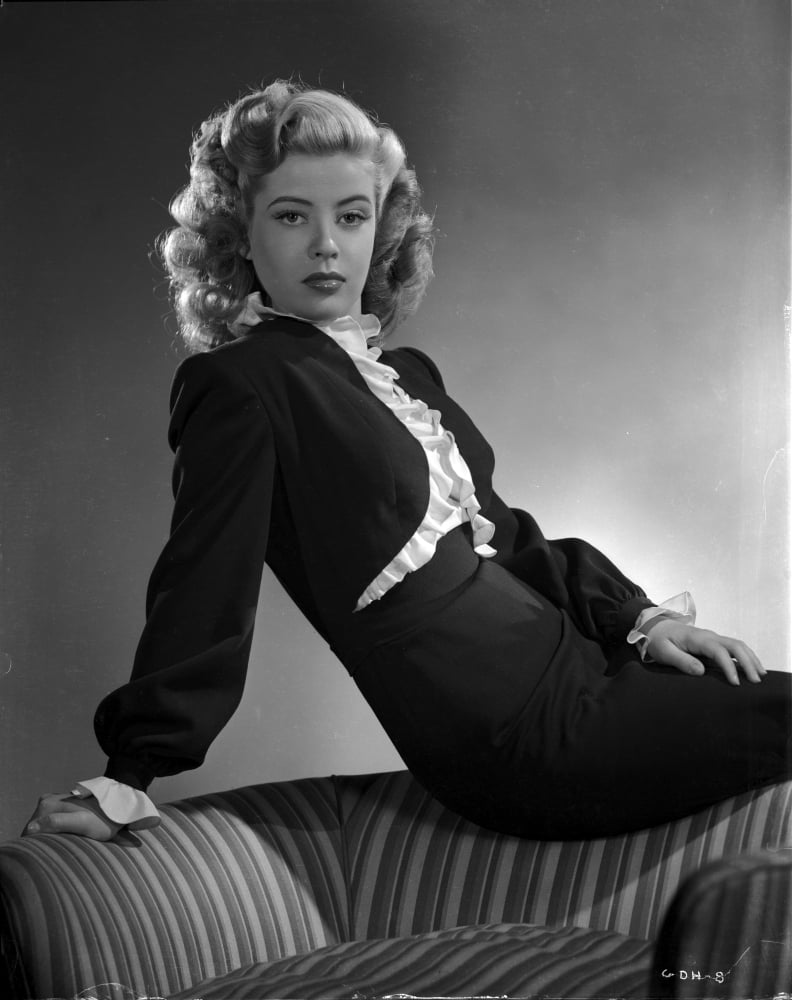 Gloria DeHaven posed elegantly on a chair in black formal dress - black and white photo print