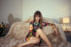 Jane Birkin photo print with legs folded on edge of fur bed.