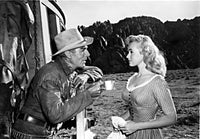 Ride Lonesome movie poster print featuring Randolph Scott and Karen Steele.