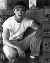 Lou Diamond Phillips crouching photo print, available in multiple sizes.