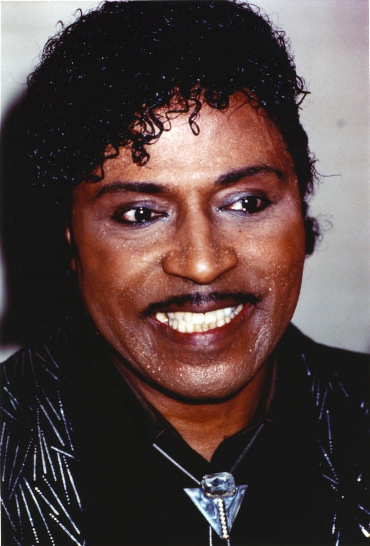 Close-up portrait photo print of Little Richard smiling.