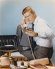 Chuck Connors holding a telephone in a white polo shirt photo print.