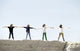 The Bee Gees posing on a cliff photo print showcasing iconic musicians.