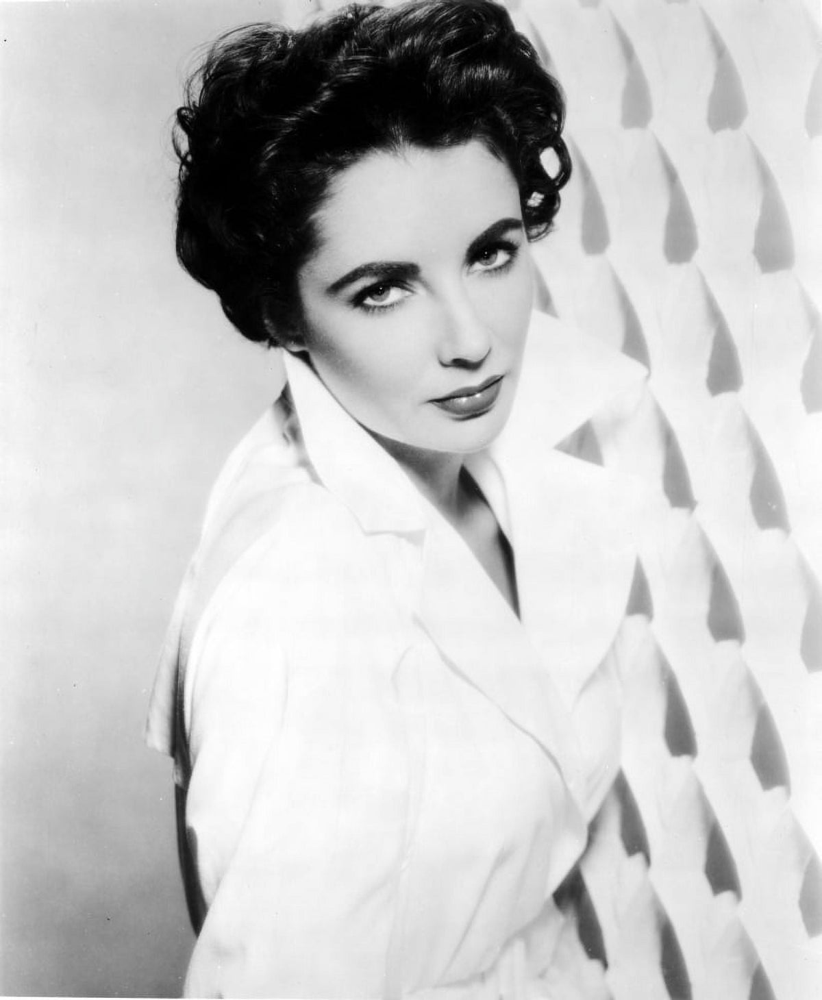 Classic portrait photo print of Elizabeth Taylor in a coat, available in multiple sizes.