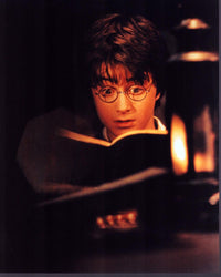 Daniel Radcliffe reading scene from Harry Potter and the Sorcerer's Stone photo print.