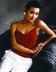 Joan Chen seated in a red outfit photo print
