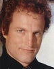 Close-up portrait photo print of Woody Harrelson in black collar shirt