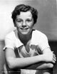 Freddie Bartholomew leaning on chair photo print