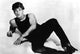 Patrick Swayze as Johnny Castle Photo Print showcasing classic movie style.