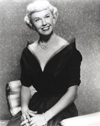 Doris Day seated in a classic pose wearing a black gown photo print