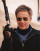 John Cassavetes photo print holding a gun in black jacket.