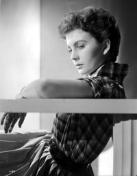 Jean Simmons leaning back in checkered short sleeve shirt photo print.
