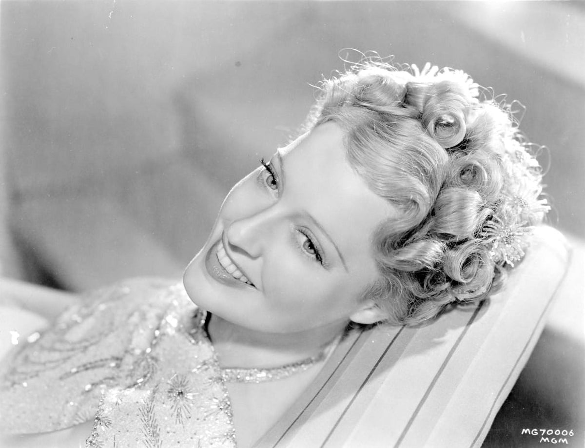 Jeanette MacDonald smiling photo print in various sizes.