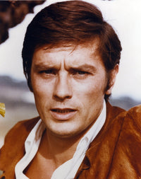 Close up portrait photo print of Alain Delon wearing a brown suit.