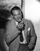 Gary Cooper smoking a cigarette in a suit photo print.