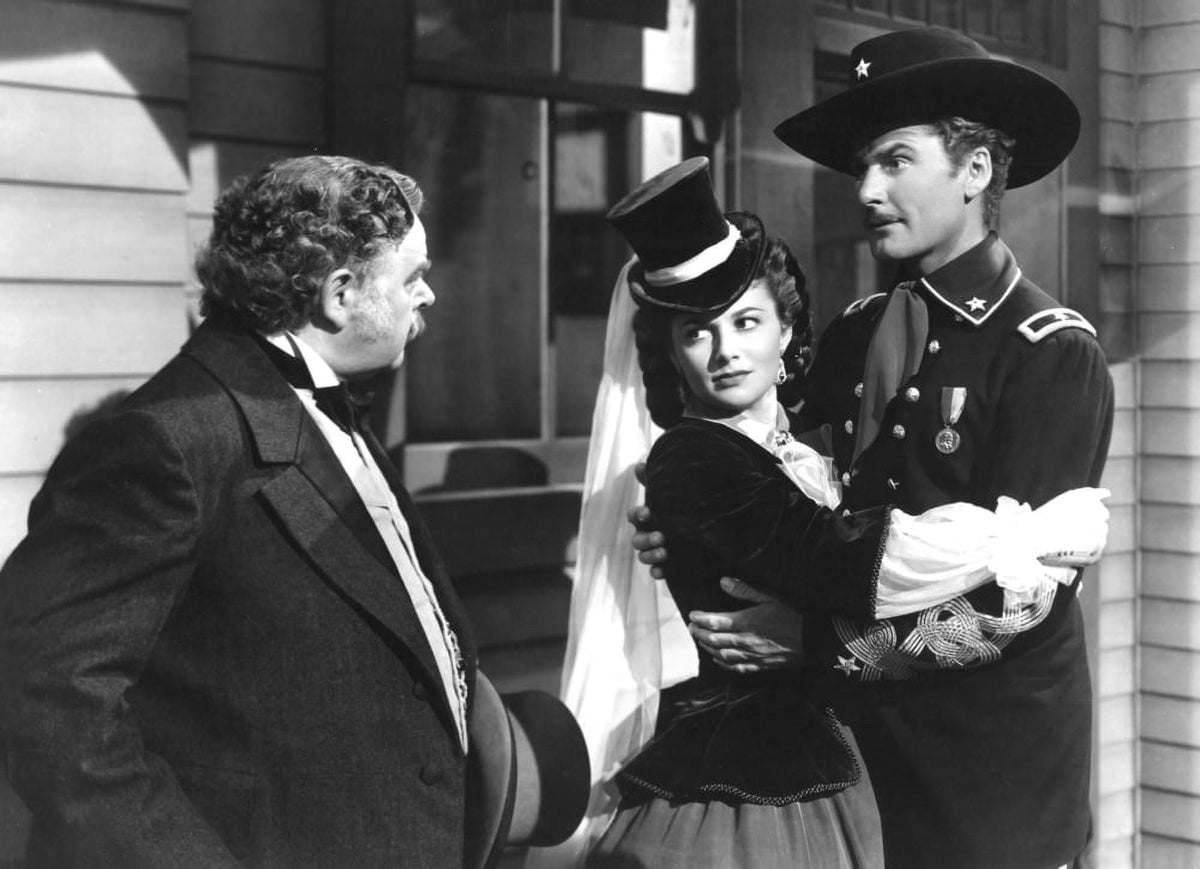 They Died With Their Boots On movie poster print featuring Errol Flynn and Olivia De Havilland