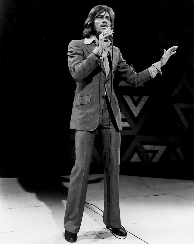 Barry Gibb live performance photo print from the Bee Gees, available in multiple sizes.