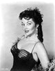 Elegant portrait photo print of Mari Blanchard in black dress with earrings.