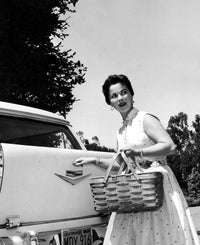 Shirley Temple holding a picnic basket photo print