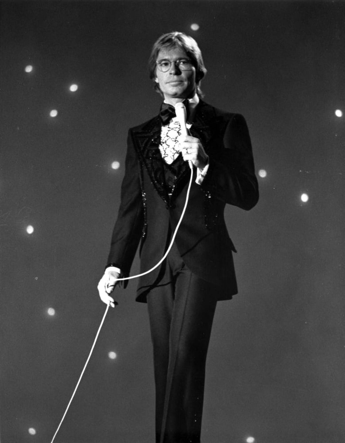 John Denver performing live photo print, perfect for music fans.