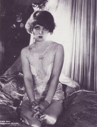 Clara Bow On Bed Photo Print in black and white, showcasing vintage Hollywood charm.