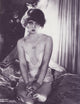 Clara Bow On Bed Photo Print in black and white, showcasing vintage Hollywood charm.
