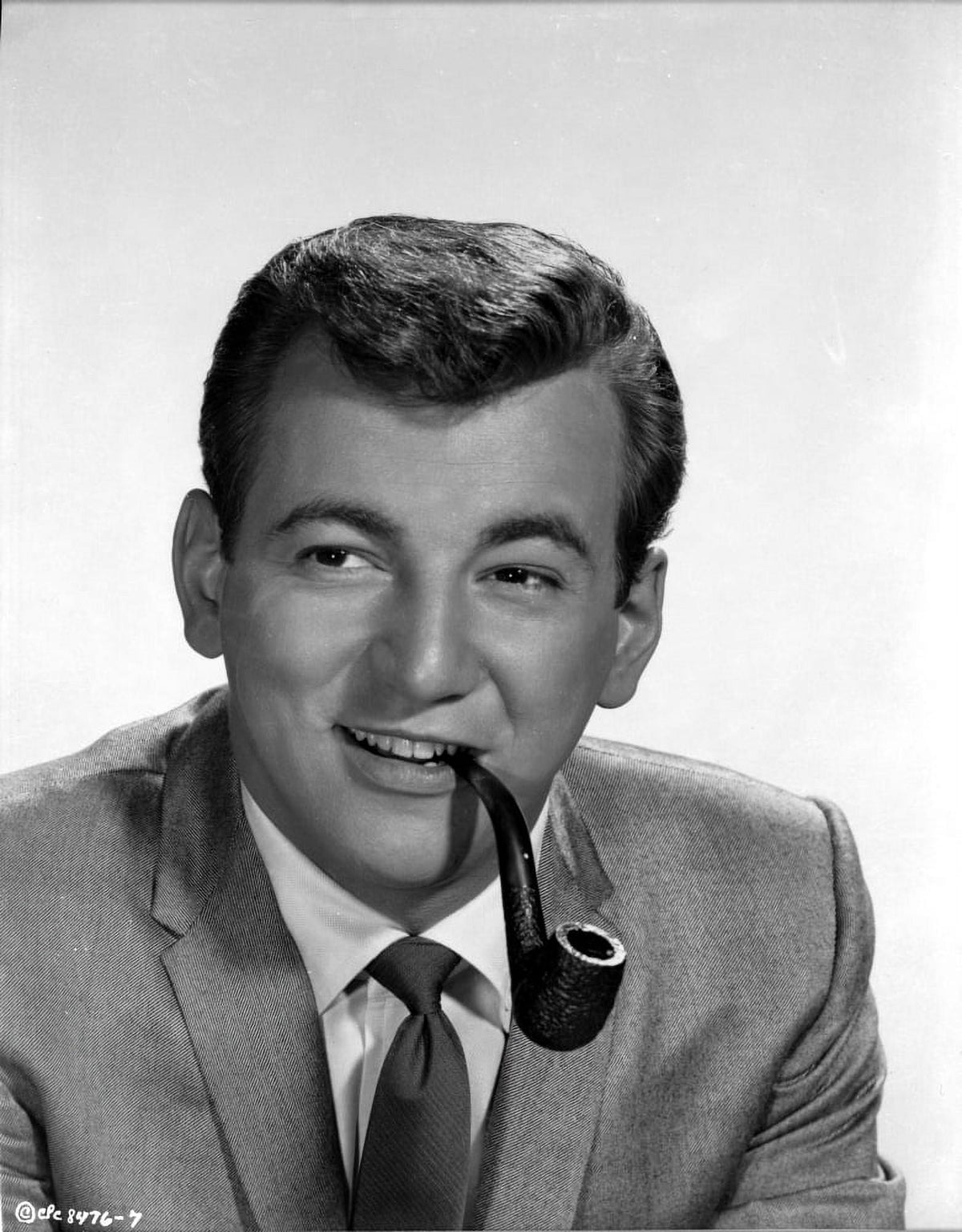 Bobby Darin smoking a pipe photo print, capturing the essence of classic music.